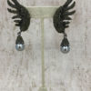 Aretes de alas y perlas