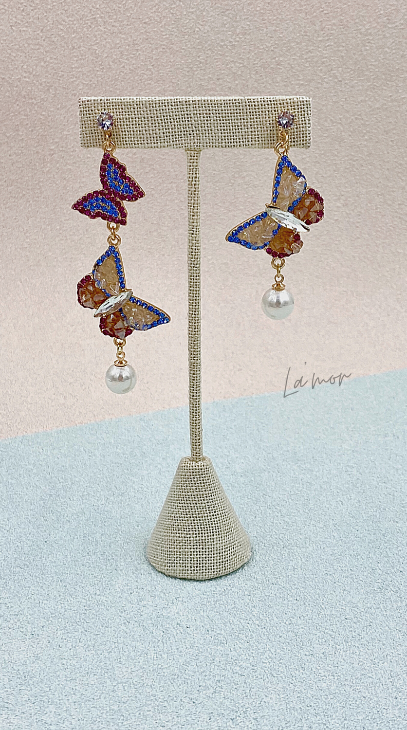 Aretes largos mariposas azul y rosa